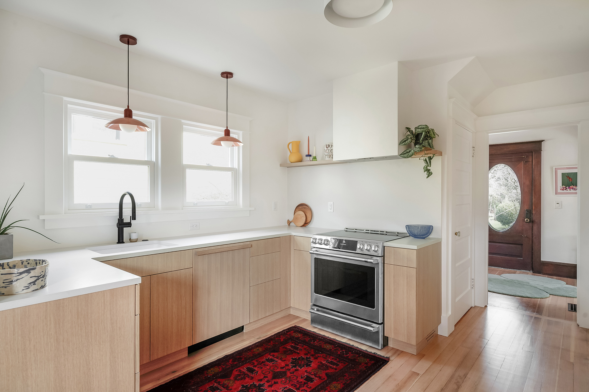 Overall view of remodeled kitchen with white oak cabinets and light palette, Alameda Kitchen by Tweto Architecture