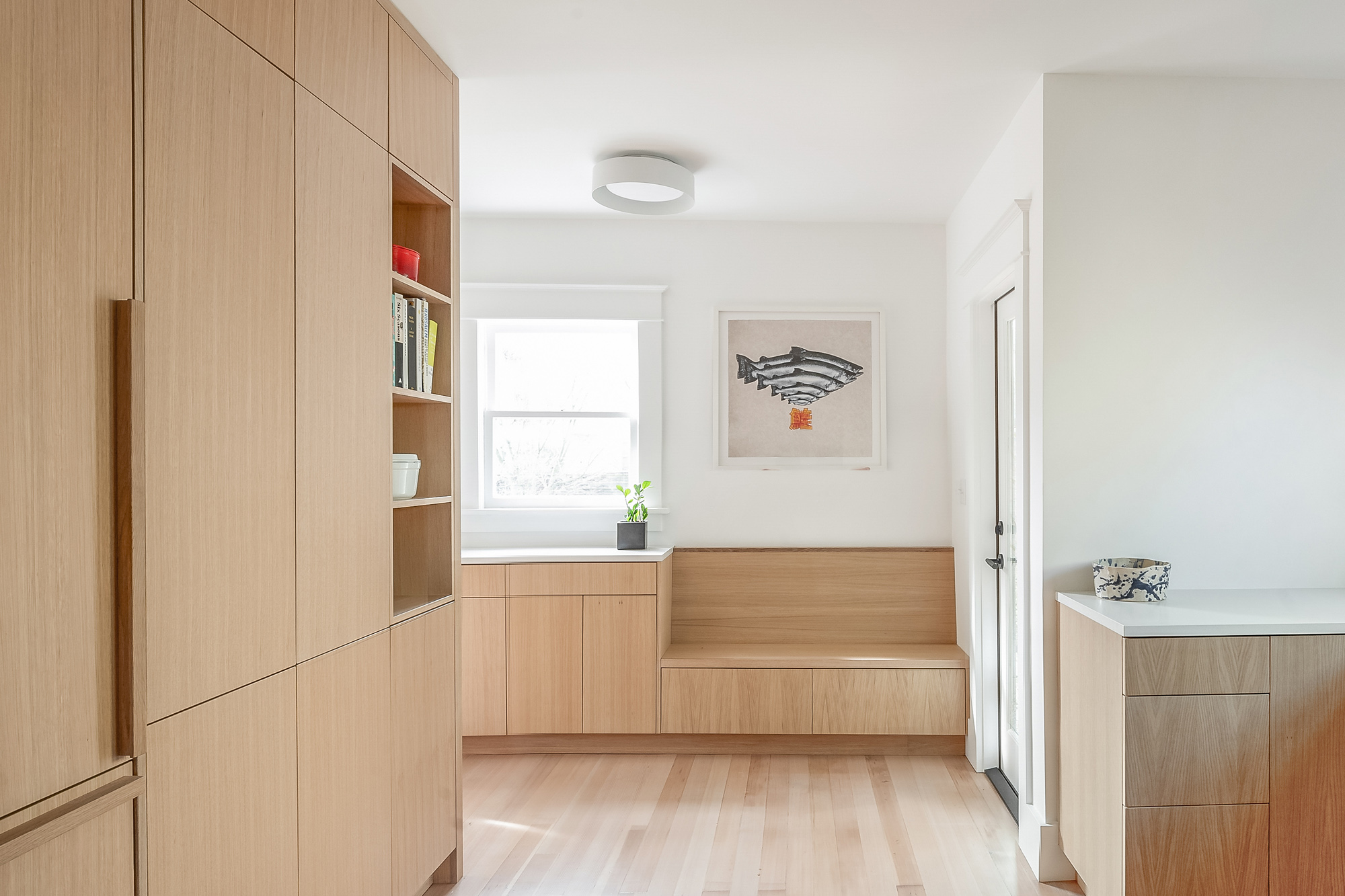 Built-in bench and storage wall with open shelving, looking back toward the kitchen, Alameda Kitchen by Tweto Architecture