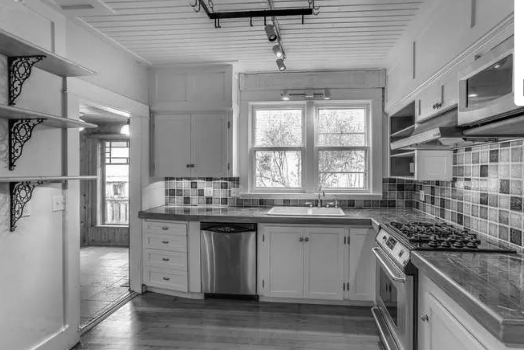 Existing kitchen before remodel showing the isolated layout, drop ceiling, and dated finishes, Baldwin Street