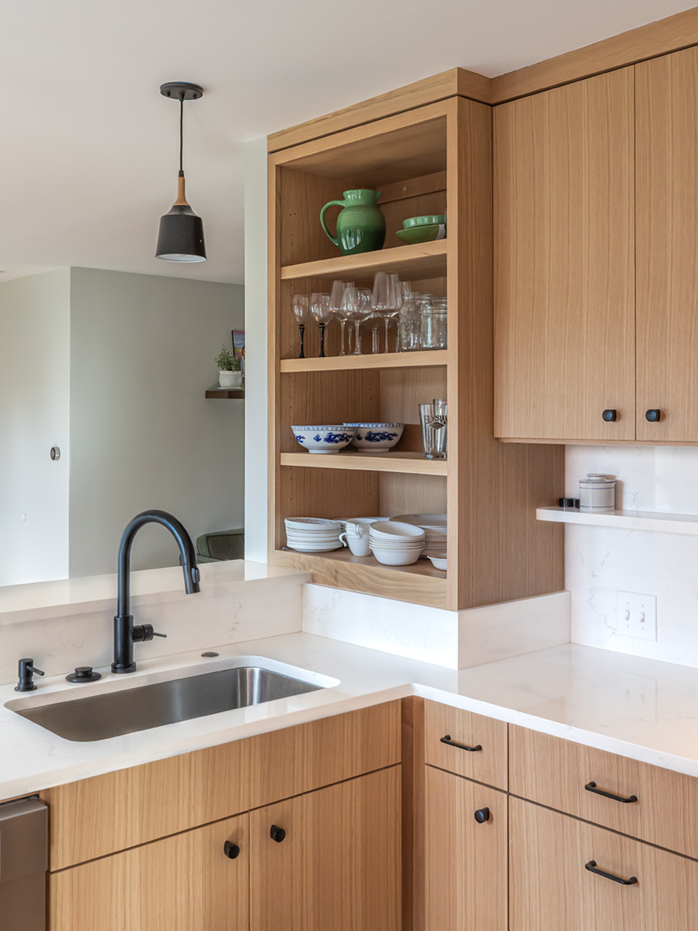 Open shelves detail with sink and black faucet, view through to dining room beyond, Brooklyn Street kitchen remodel by Tweto Architecture