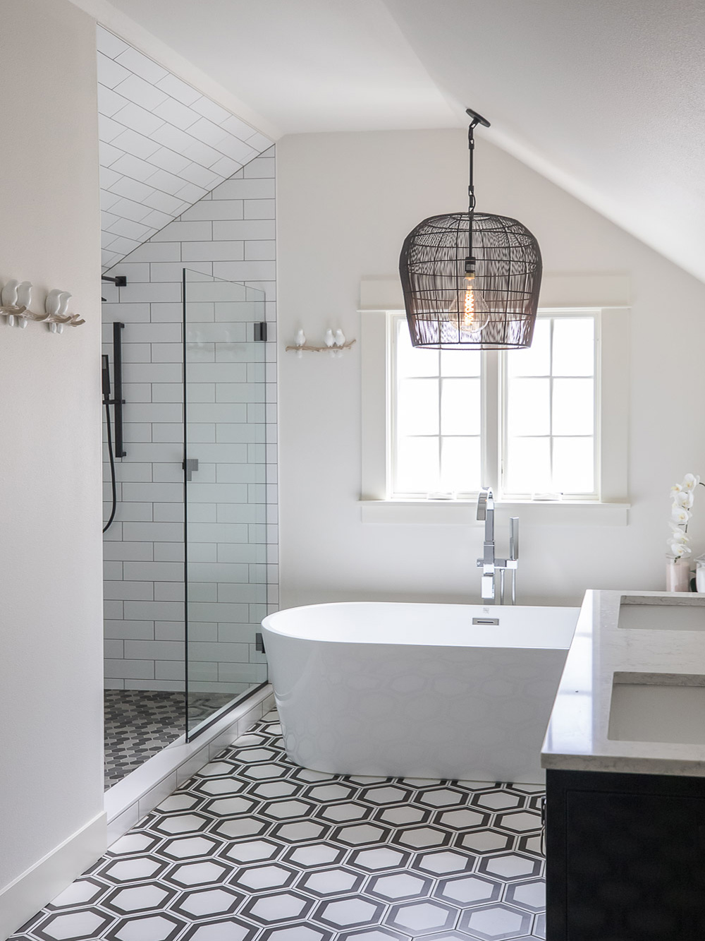 Soaking tub below large windows, Carolina Primary Suite addition by Tweto Architecture