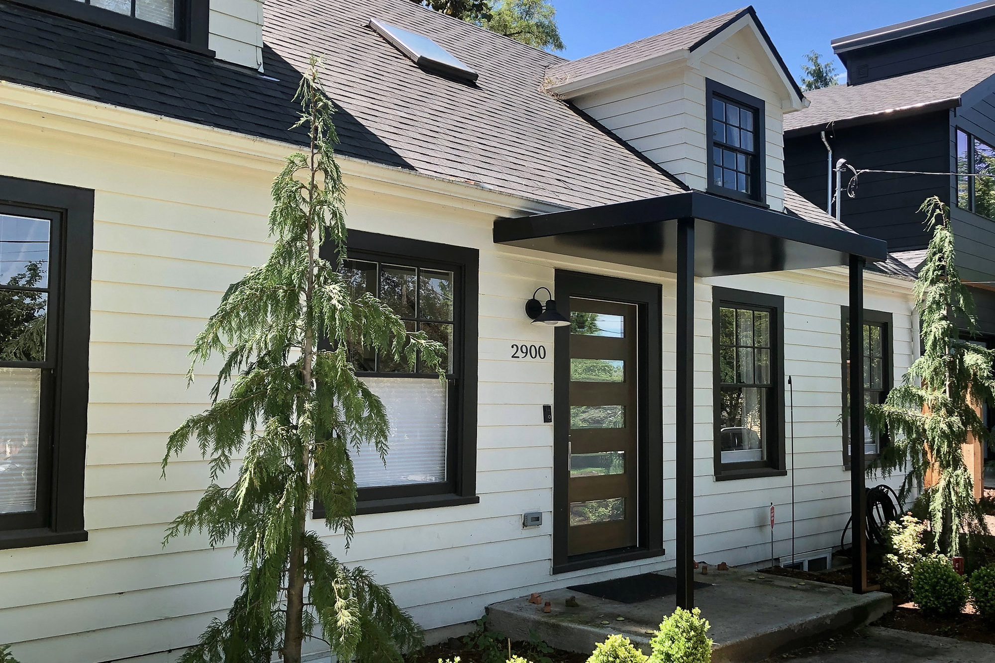 New steel entry canopy at front door, Carolina Primary Suite addition by Tweto Architecture, SW Portland