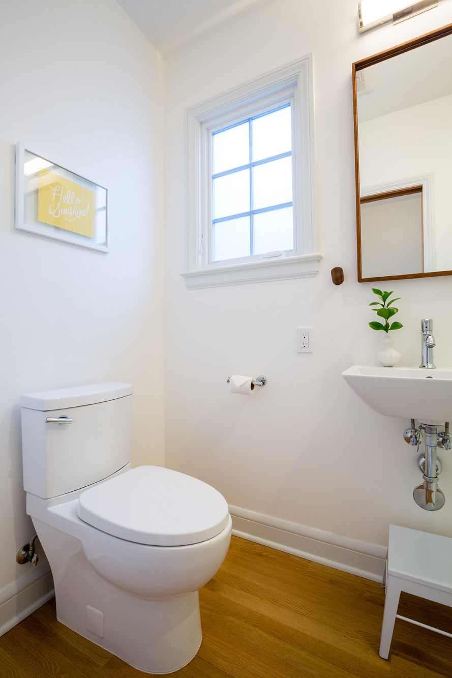 New compact main floor bathroom with pedestal sink and casement window, Mt. Tabor Tudor remodel by Tweto Architecture