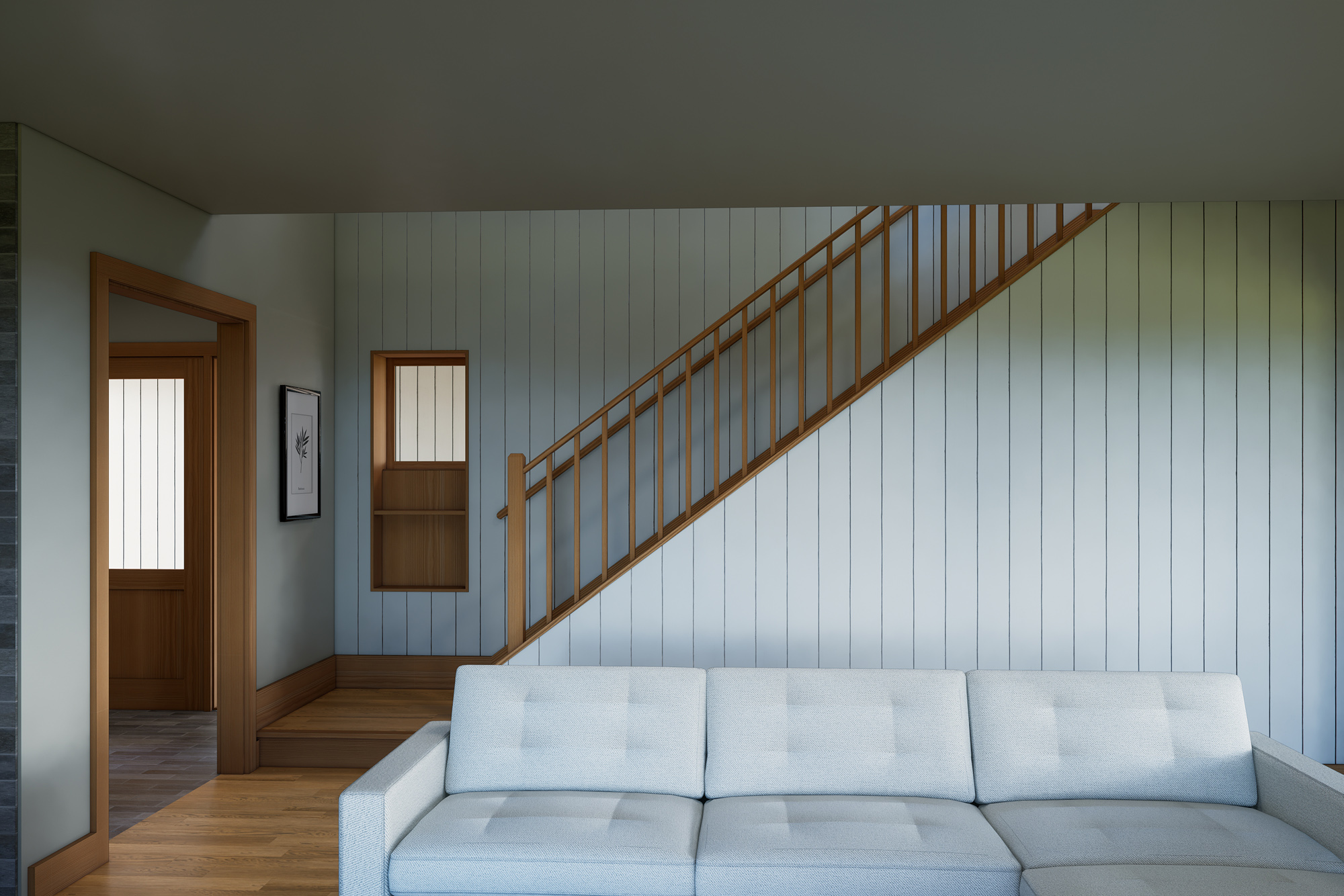 Open stair with wood railing against a vertical shiplap wall, living area sofa in foreground and entry door visible beyond, Mountaindale Home by Tweto Architecture