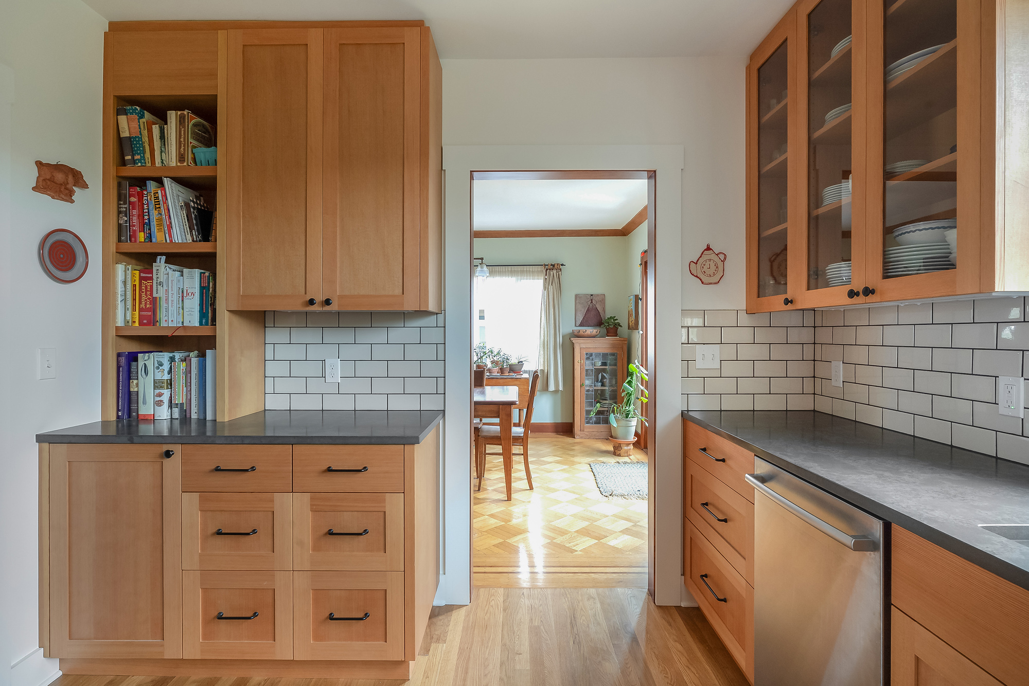Coffee counter with bookcases looking toward the dining room, Sabin Kitchen by Tweto Architecture
