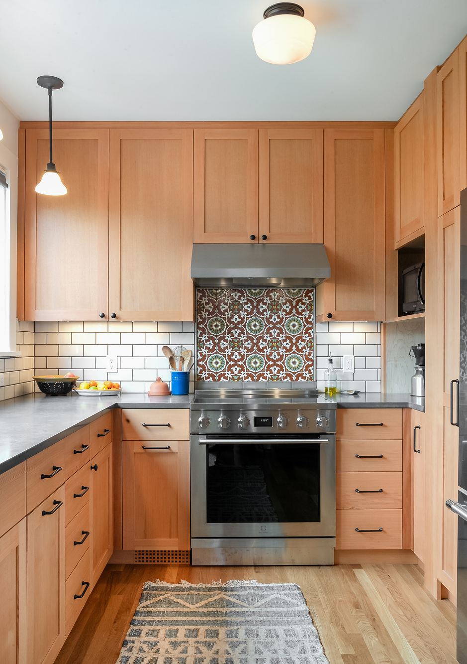 Decorative tile range accent with white subway tile backsplash, Sabin Kitchen | Kitchen Remodel ArchitectNE Portland