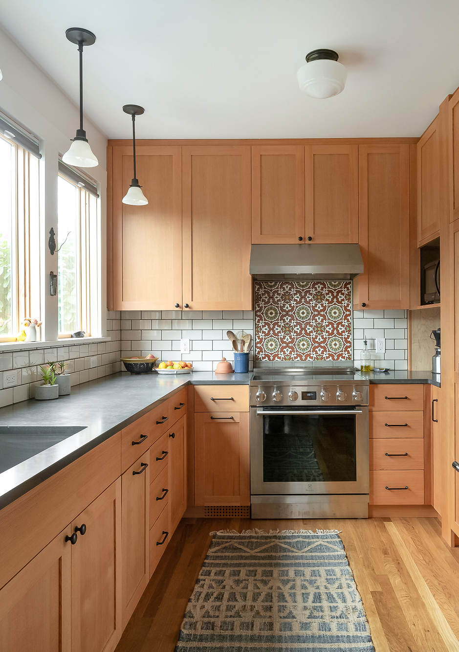 Remodeled kitchen with vertical grain Douglas Fir cabinets and enlarged east windows, Sabin Kitchen by Tweto Architecture